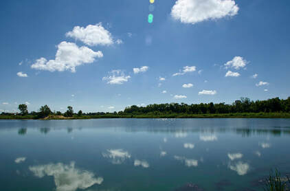 A blue sky and clear lake at Terry Trueblood Recreation Area in Iowa City, IA